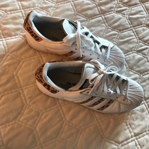 Adidas Superstar leopard sneakers.